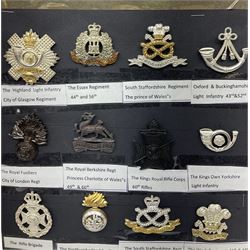 Collection of thirty-two reproduction military badges, including Royal Scots Fusiliers, Royal Lincolnshire Regiment, The Boarders Regiment etc. 