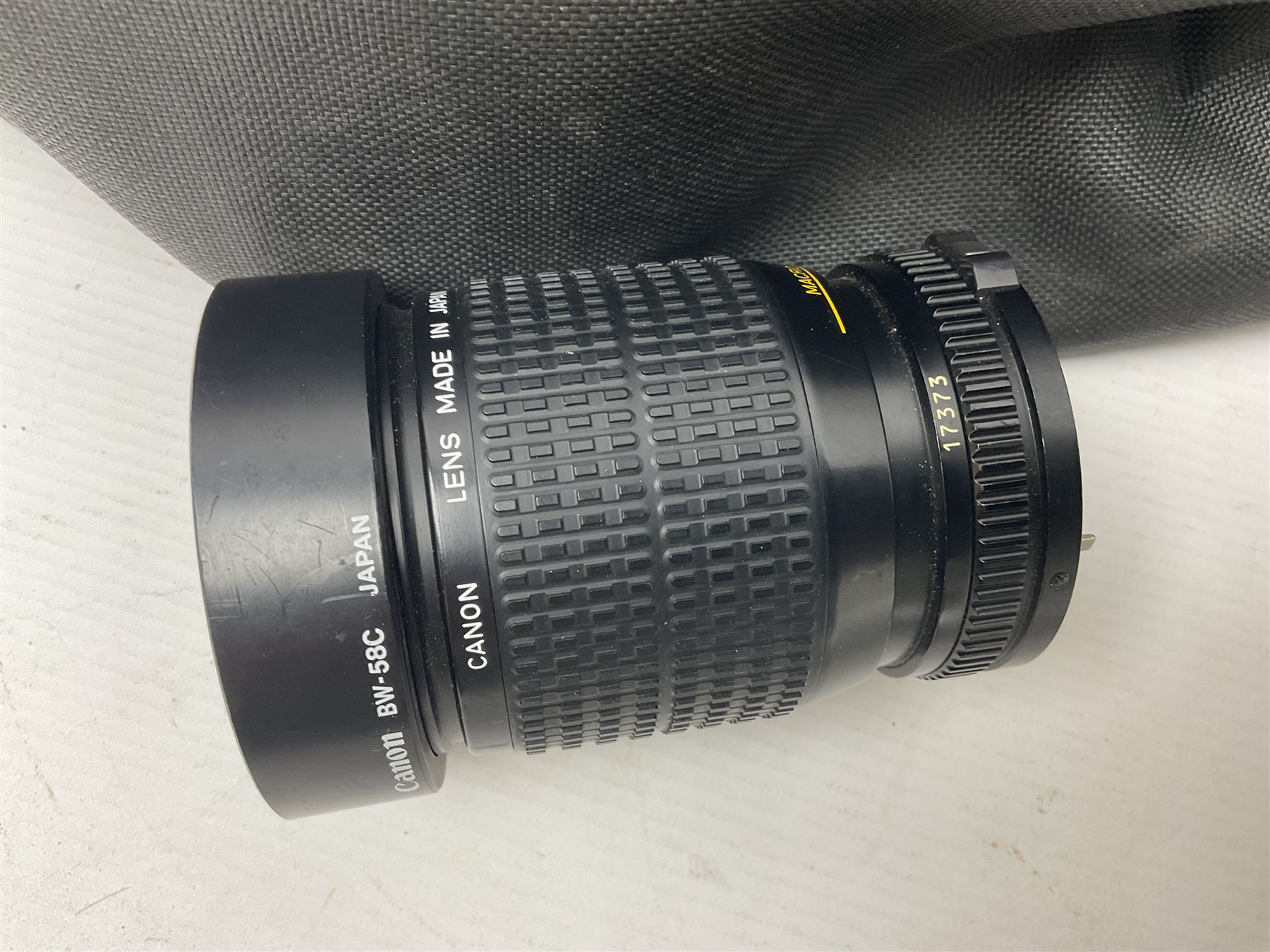 Canon A1 camera body, serial no 775843, together with 'Canon Lens FD 200mm 1:4 lens' serial no 24432, together with Semi Minolta folding camera, Canon 'Zoom FD 35-105mm 1:3.5-4.5' lens, Canon 'Macro Focusing Zoom 72mm Hanimex HMC 28-200mm' lens and other camera equipment  