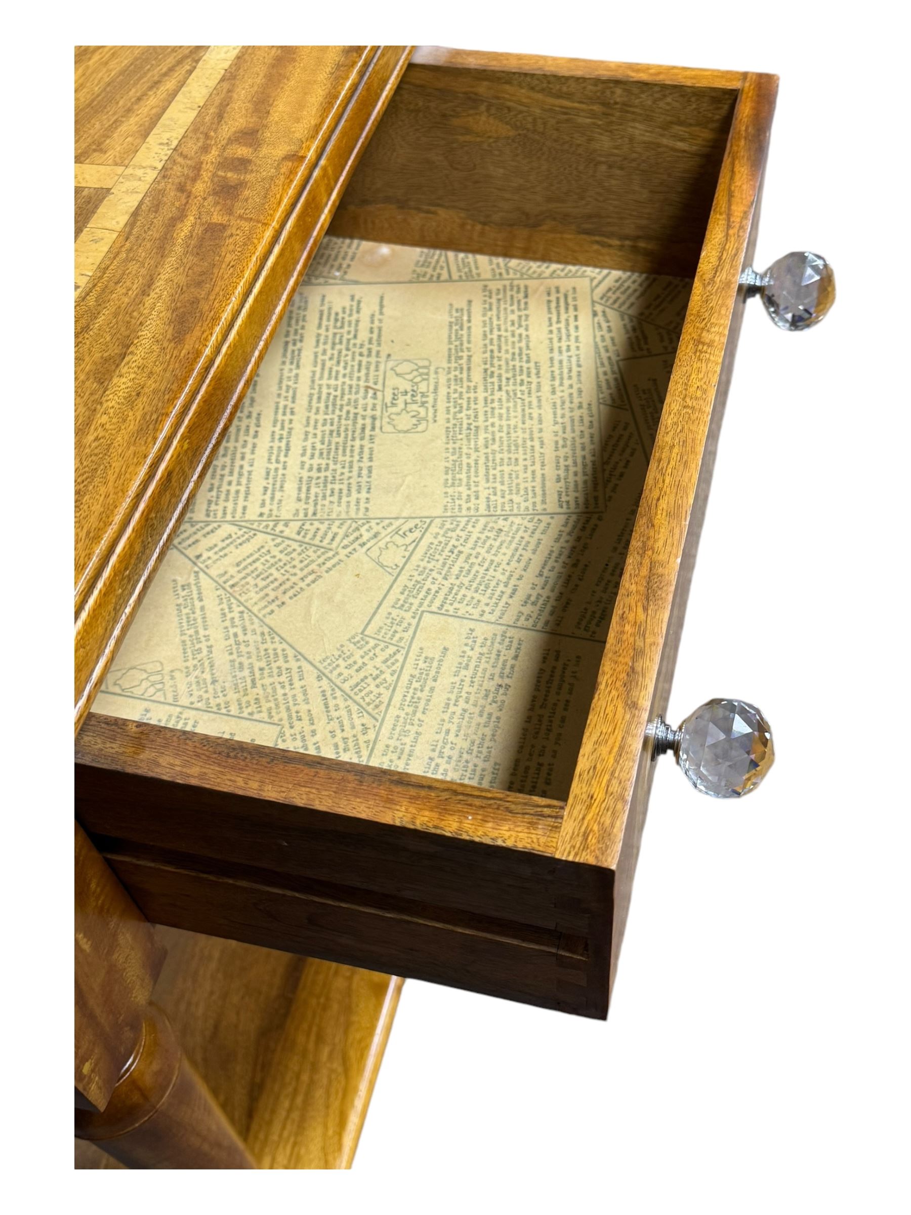 Barker and Stonehouse -  contemporary 'Flagstone' side table, rectangular crossbanded top with central diamond inlay, over single frieze drawer with faceted glass pulls, turned columns and undertier shelf, raised on bun feet