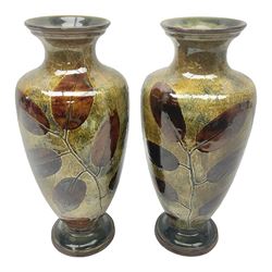Pair of Royal Doulton Stoneware Vases with leaf decoration, by Ethel Beard, impressed marks to base numbered 6768 and 8222 and initials EB, H32cm