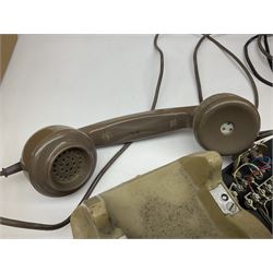 Early-mid 20th century internal telephone system, comprising exchange box with attached TMC rotary telephone and dictograph with Bakelite handset and support upon stained wood case, and 1960s black Bakelite telephone model 312L with G.P.O sticker beneath, largest H30.5cm W36.5cm D30cm