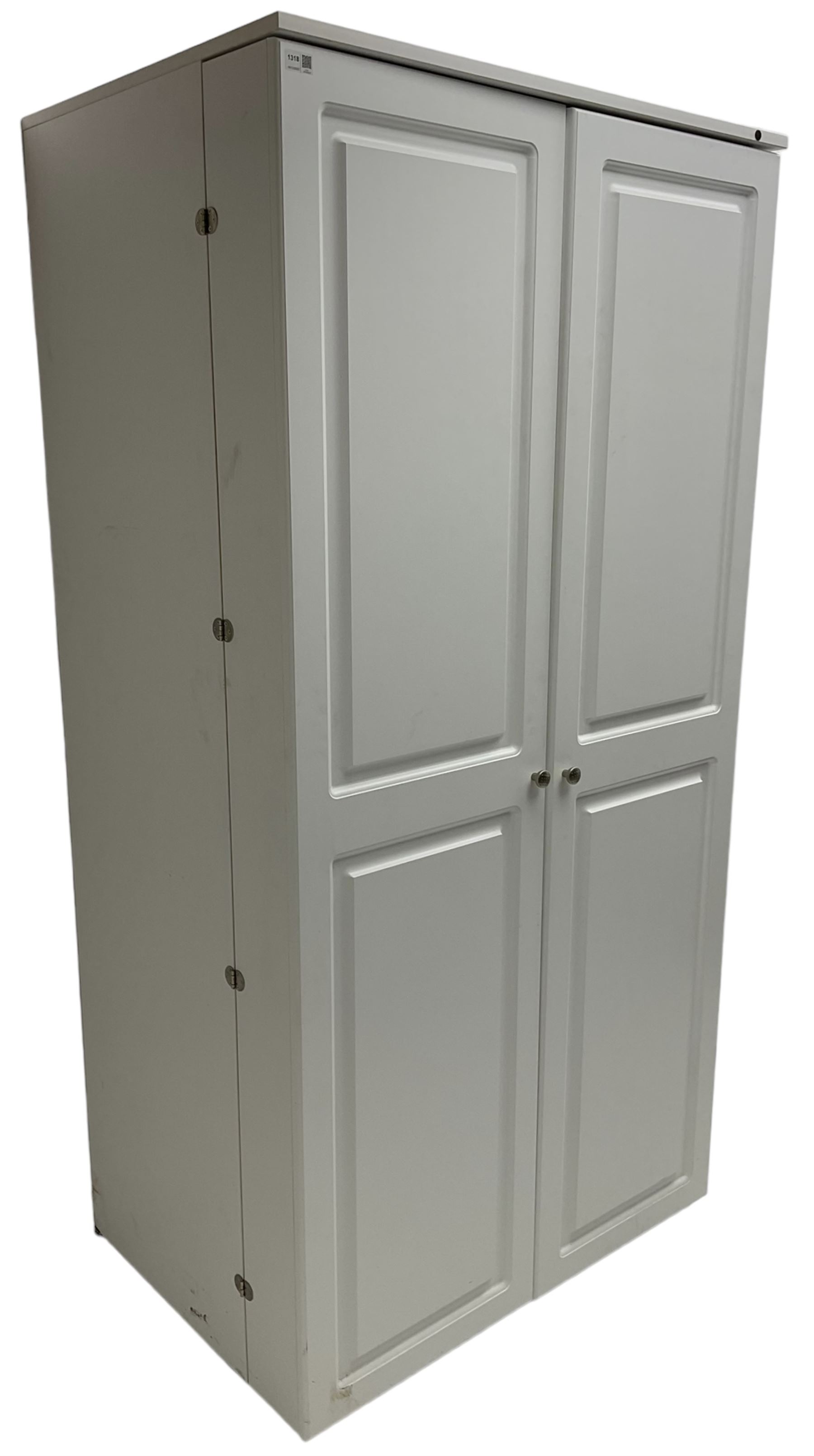 Large white finish sewing cabinet, enclosed by two doors fitted with thread holders and shelves, the interior fitted with shelves and sliding trays, with fold down work surfaces 