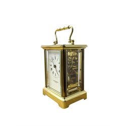 Taylor & Bligh - English 8-day carriage clock in a corniche-style case, white dial with roman numerals and steel moon hands, 11 jewel movement with a lever platform escapement. With key.