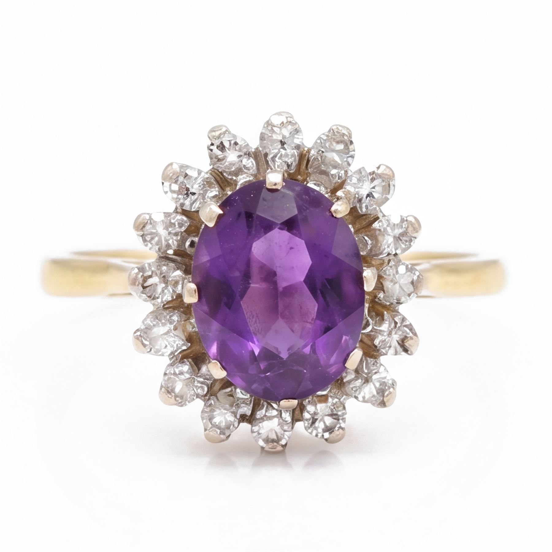 18ct gold amethyst and diamond cluster ring, single oval cut amethyst surrounded by sixteen single cut diamonds, London 1967