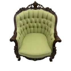 Late 20th century continental baroque three piece lounge suite, carved beech framed, upholstered in buttoned pale green fabric, overall floral and acanthus scroll carved decoration with pierced detail, comprising three seat sofa (W200cm), and a pair of armchairs (W84cm)