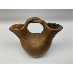 Native American Indian clay wedding vase of double necked bulbous form and a pair of candle holders, all with fire cloud effect, and signed 'Juanita' beneath, vase H13.5cm 
