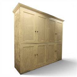 Large Georgian painted pine housekeepers cupboard, projecting cornice with four sets of twin cupboard doors with shelving enclosed