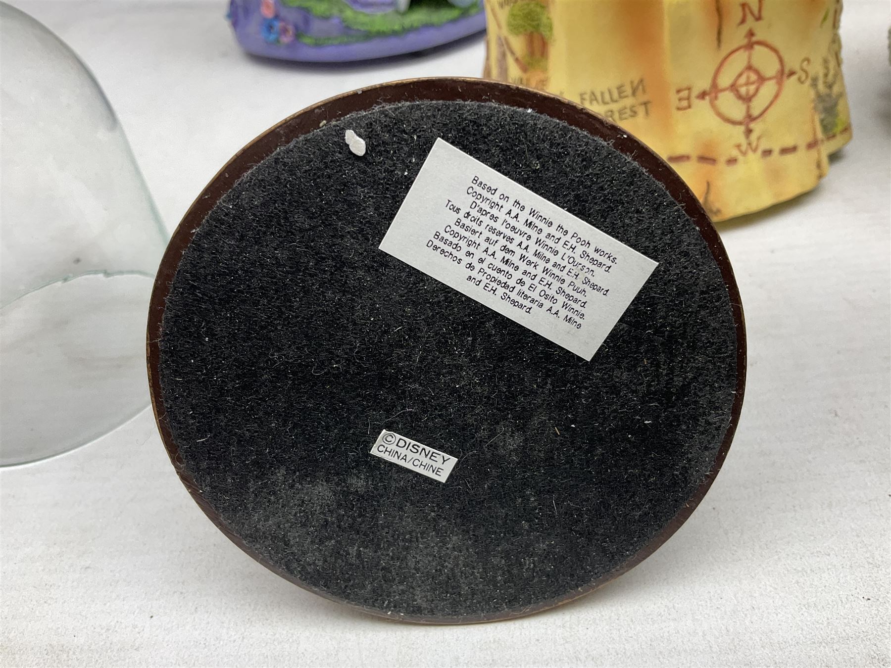 Five Disney Winnie The Pooh snow globes, to include Pooh and Piglet Sailing, Pooh's Grand Adventure and Blustery Day, together with The Walt Disney Classic Waterglobe collection globe and group Tigger, Winnie and Piglet figure under dome, all with boxes (7)