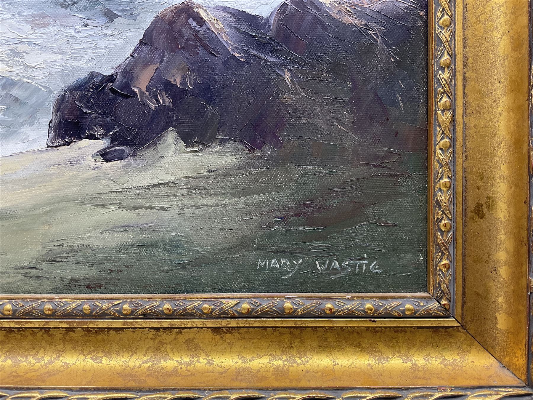 Mary Wastie (Cornish 1935-): Rocky Seascape near Pendeen, oil on canvas signed 39cm x 65cm 