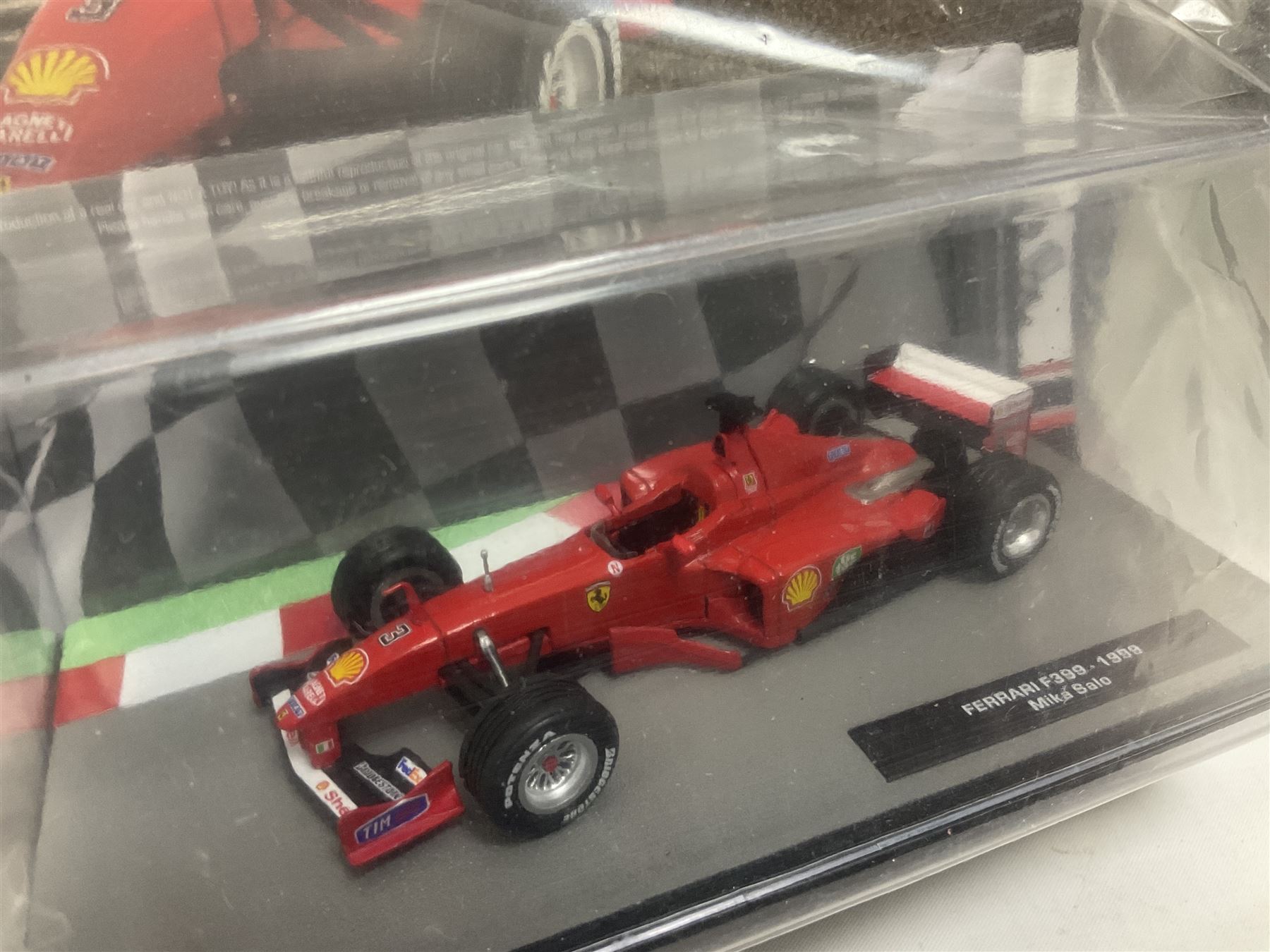 Panini Formula 1 The Car Collection - twelve die-cast models including ten in unopened packaging with periodical; all models in plastic display boxes; and eight other boxed die-cast models of racing cars by Corgi, Onyx, Classico, Minichamps etc (20)