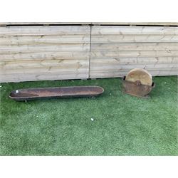 Small stone sharpening wheel, and a shallow cast iron trough - THIS LOT IS TO BE COLLECTED BY APPOINTMENT FROM DUGGLEBY STORAGE, GREAT HILL, EASTFIELD, SCARBOROUGH, YO11 3TX