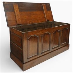 Late 19th century Gothic Revival oak coffer, the plain hinged top over four fielded arch moulded panels, the sides panelled and raised on a block plinth, the interior with vertical boarding and later iron hinges