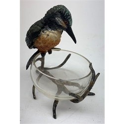 A cold painted model of a Kingfisher surmounted upon a branch surporting a small clear glass bowl, H10.5cm, together with a small bronze model of a penguin, stamped EWB, H7cm. 