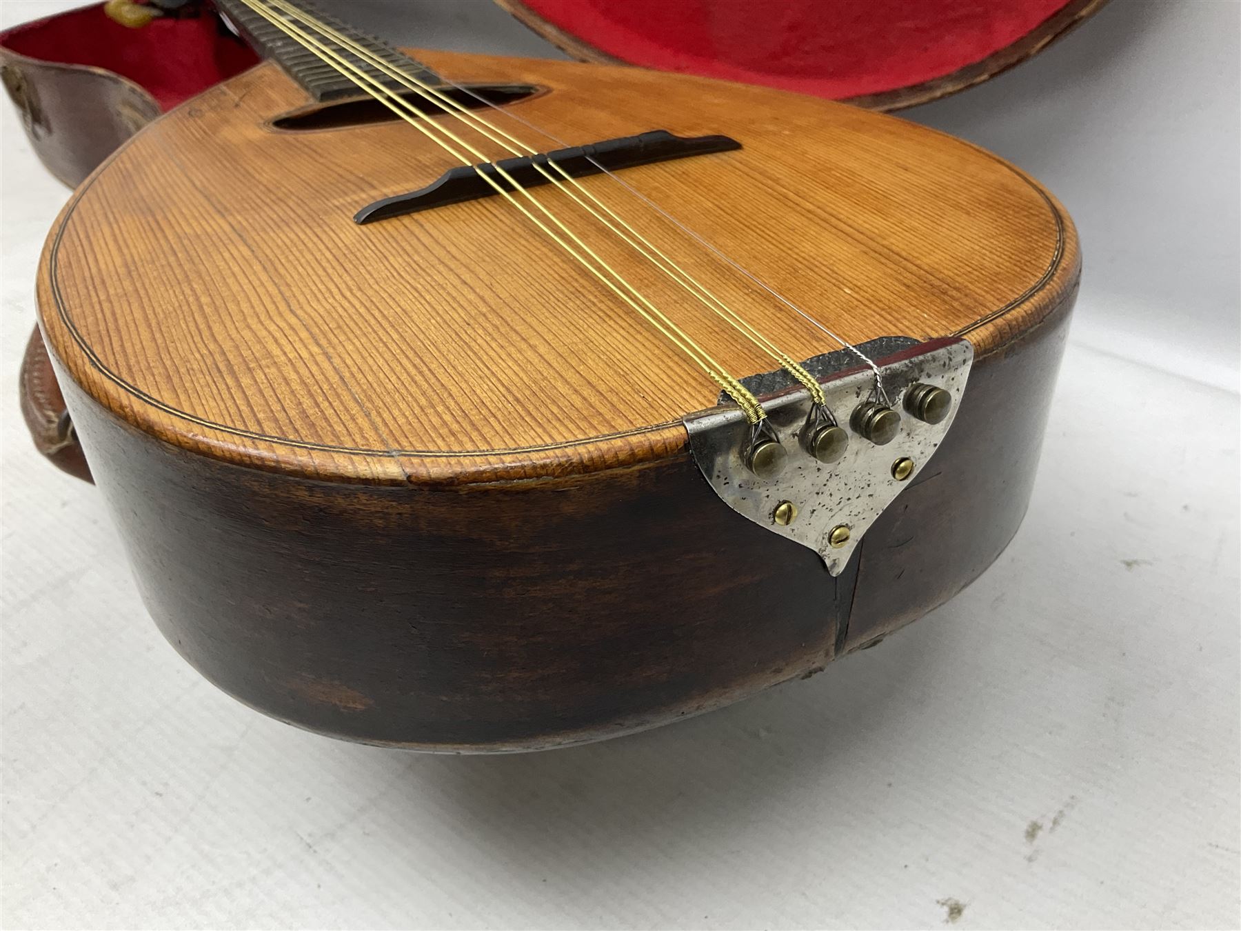 Early 20th century Italian Rafaele Disantino eight-string mandolin with two-piece back and spruce top with stamped Rafaele Disantino signature; bears maker's label L61cm; in wooden carrying case