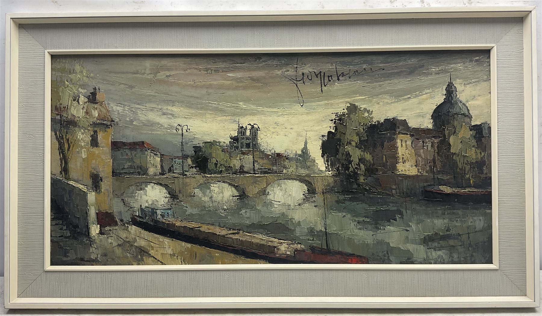 Continental School (Mid 20th century): City River scene with Commercial Barge, oil on canvas indistinctly signed 38cm x 78cm
Provenance: with John Mathieson & Co, 20 Frederick Street, Edinburgh, 1950/60's label verso