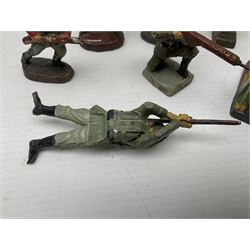 Seven Elastolin German Armys figures, with various weapons including mortar, tallest H9cm 