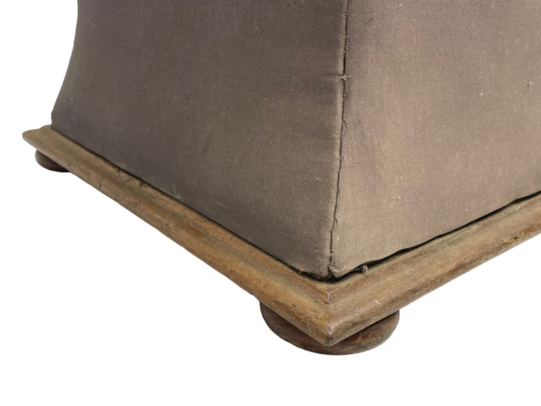 19th century upholstered ottoman, rectangular waisted form with hinged lid, upholstered in needle work cover decorated with floral panels and borders, the interior lined in blue fabric, lower moulded edge over compressed bun feet