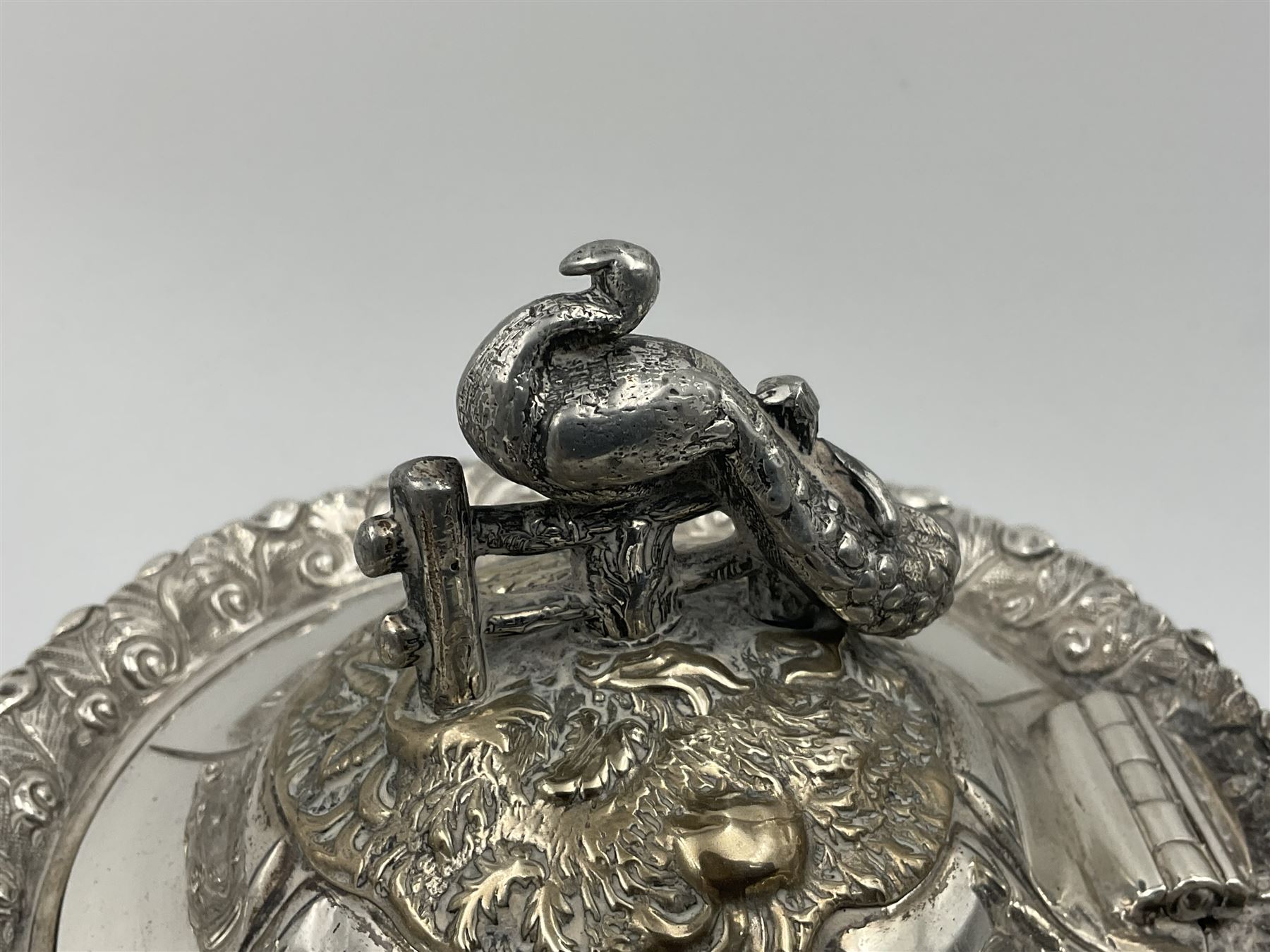 Victorian silver three piece tea service, comprising teapot, twin handled open sucrier, and milk jug, each of bellied form with acanthus capped scroll handles, the sides embossed with alternating scroll edged vacant panels and panels containing a pair of birds, upon four palmette feet, the teapot with ivory insulators to handle, and bird finial to the hinged domed cover, hallmarked William Hunter & Son, London 1861, teapot H19cm, including handles sucrier H13.5cm, including handle milk jug H12cm

This item has been registered for sale under Section 10 of the APHA Ivory Act