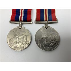 Ten WW2 medals comprising two 1939-1945 war medals, two Defence medals, two 1939-1945 Stars, two Africa Stars, France & Germany Star and Burma Star; together with bar of four miniature medals; all with ribbons