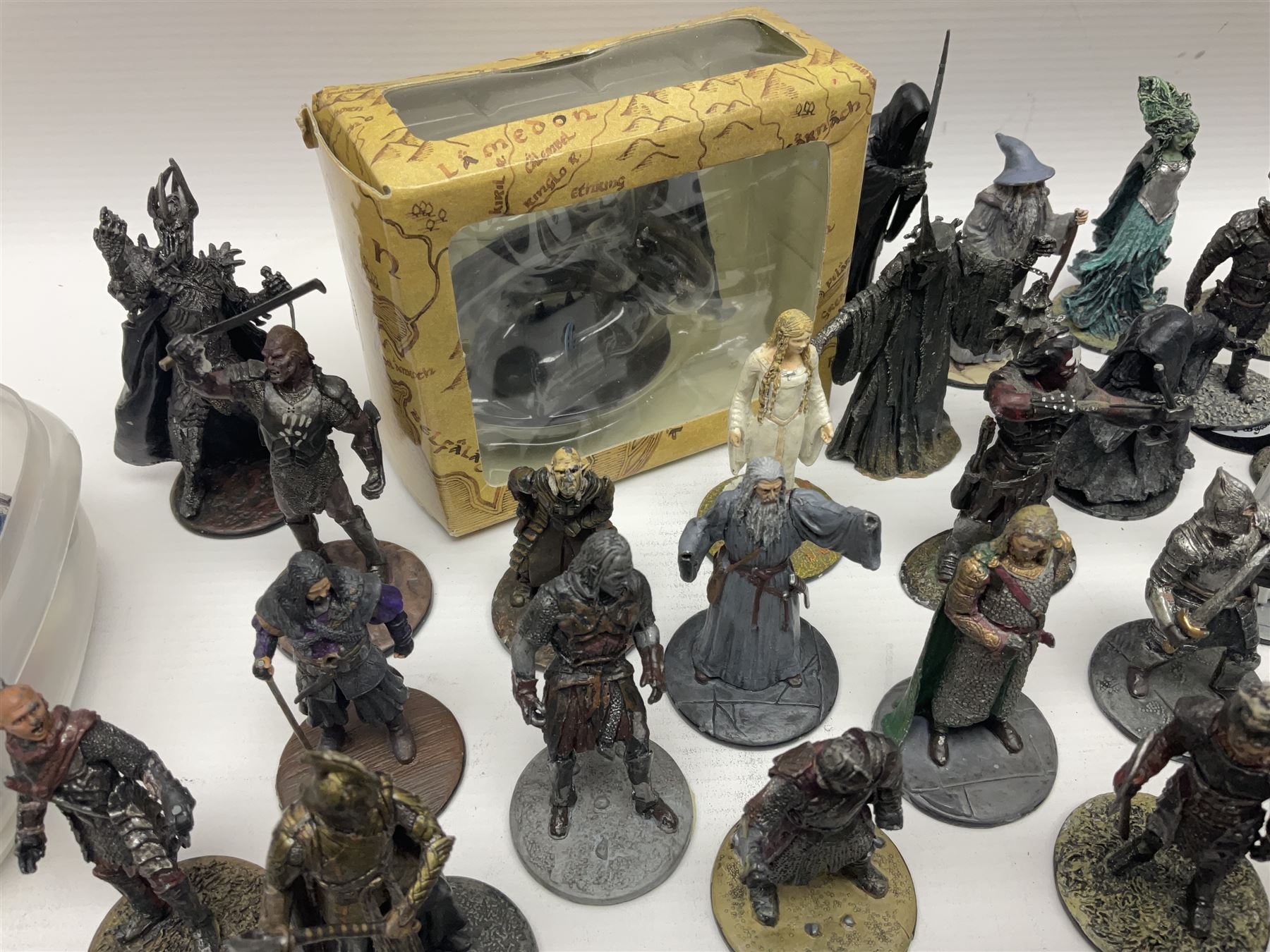 Approximately 80 NLP Lord of the Rings heavy metal painted figurines to include Fell Beast, boxed, and The Watcher, The Dark Lord Sauron, Treebeard etc, and unassociated Dracula themed composite figures marked HHFT50 