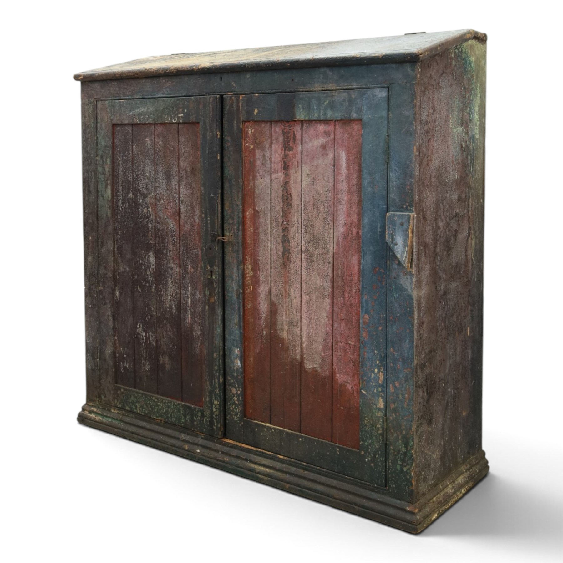 19th century painted and lacquered pine clerks desk bureau on cupboard, hinged fall-front enclosing three compartments, over slatted panelled doors enclosing two perforated shelves, on skirted base, in rustic forest green and red finish