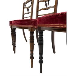 Edwardian inlaid rosewood salon suite, upholstered in red and gold fabric, comprising two seat sofa, pair of tub shaped armchairs, and four side chairs