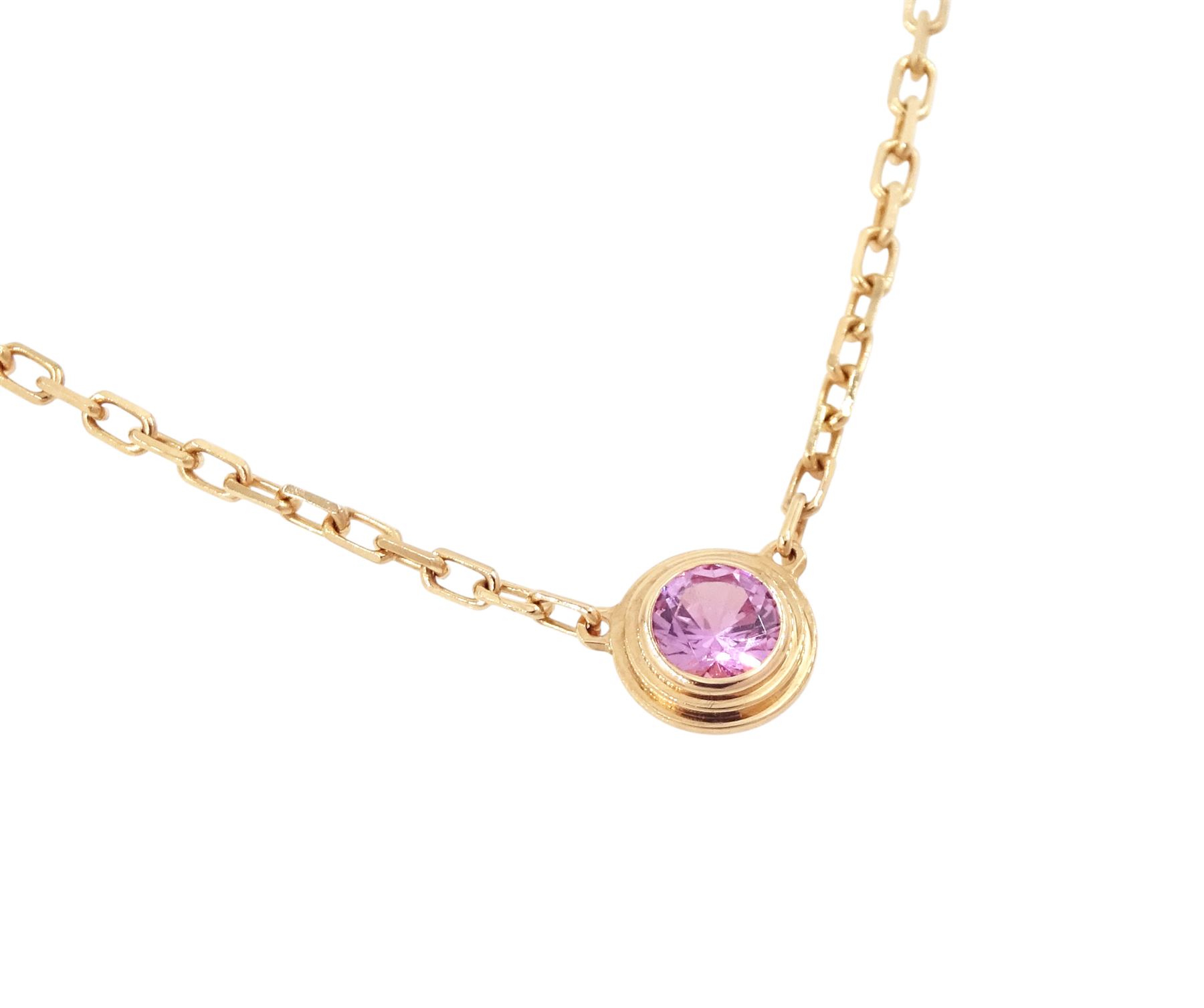Cartier d'Amour 18ct rose gold pink sapphire pendant necklace, bezel set with a single round cut sapphire of approx 0.15 carat, boxed with certificate