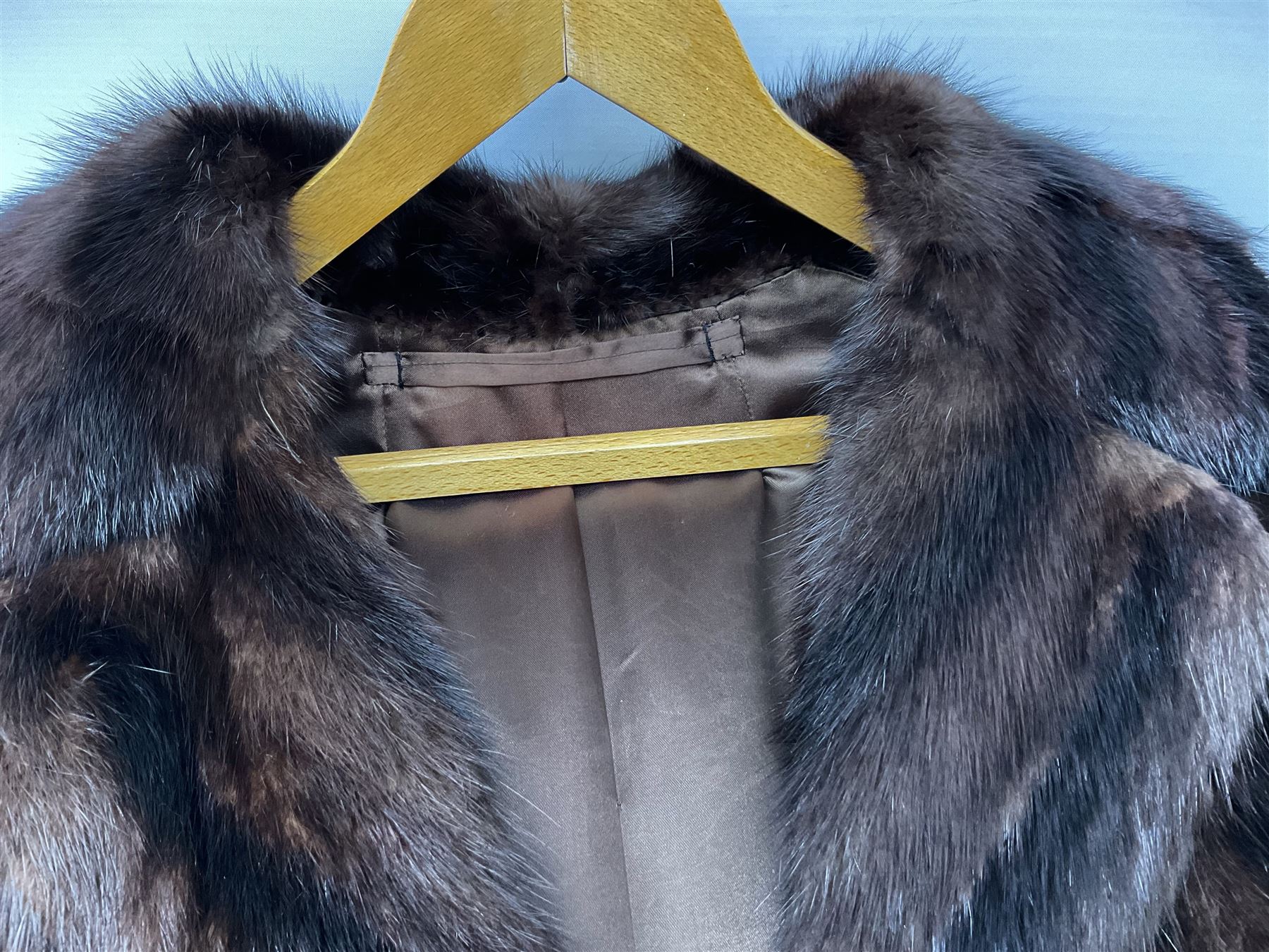 Ladies three quarter length brown mink coat, together with a ladies short black rabbit fur coat 