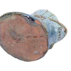 C. H. Brannam pottery Candle holder modelled as a Frog, with  flower upon its back, with signature to base, H8cm 