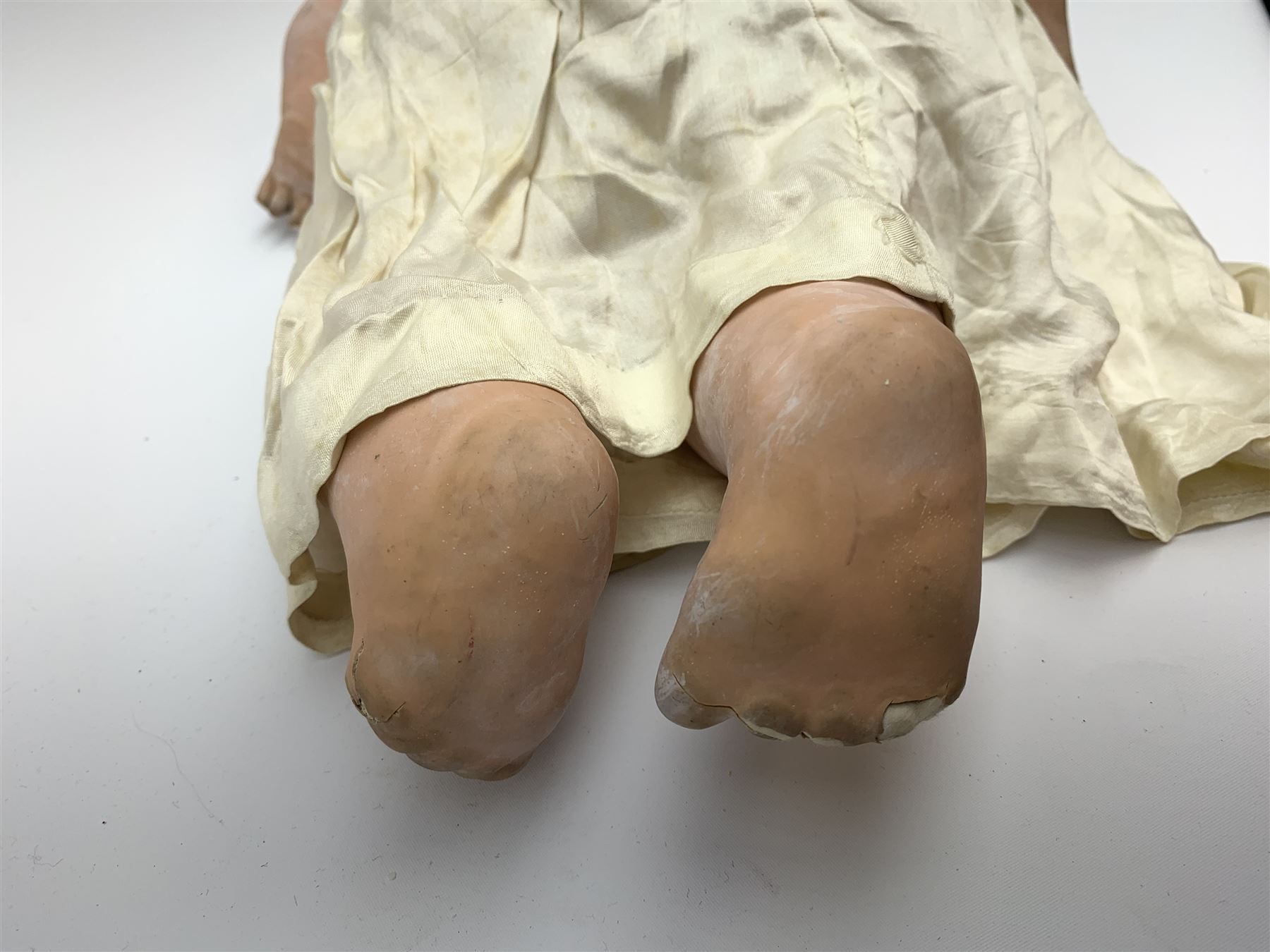 Seyfarth & Reinhardt composition head baby doll with moulded hair, sleeping flirty eyes, open mouth with one tooth and tongue and soft body with composition jointed limbs, marked 'SuR Germany 30/5' H47cm; together with a Golborne Dolls 'Golborne Beauty' composition head and body bride doll, marked 'F.P.23' in original box H63cm (2)