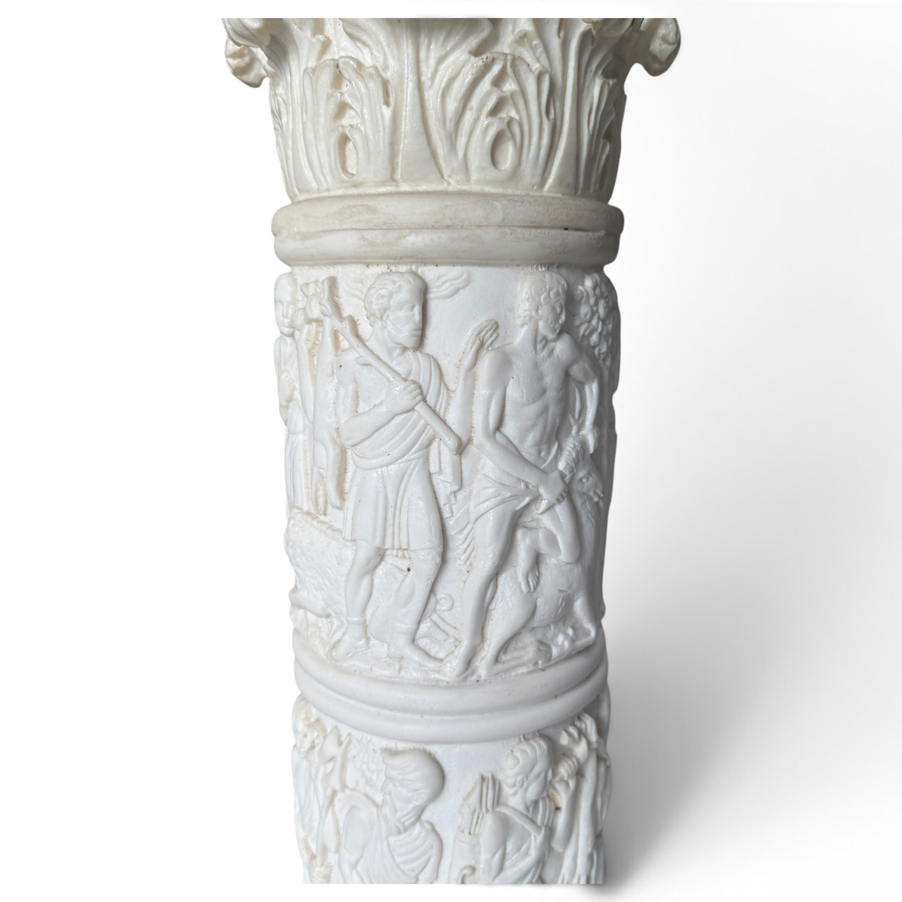 Neoclassical design composite column, square top over composite Ionic and Corinthian capital, the pedestal decorated with hunting and religious procession scenes, waisted and foliate socle on square base