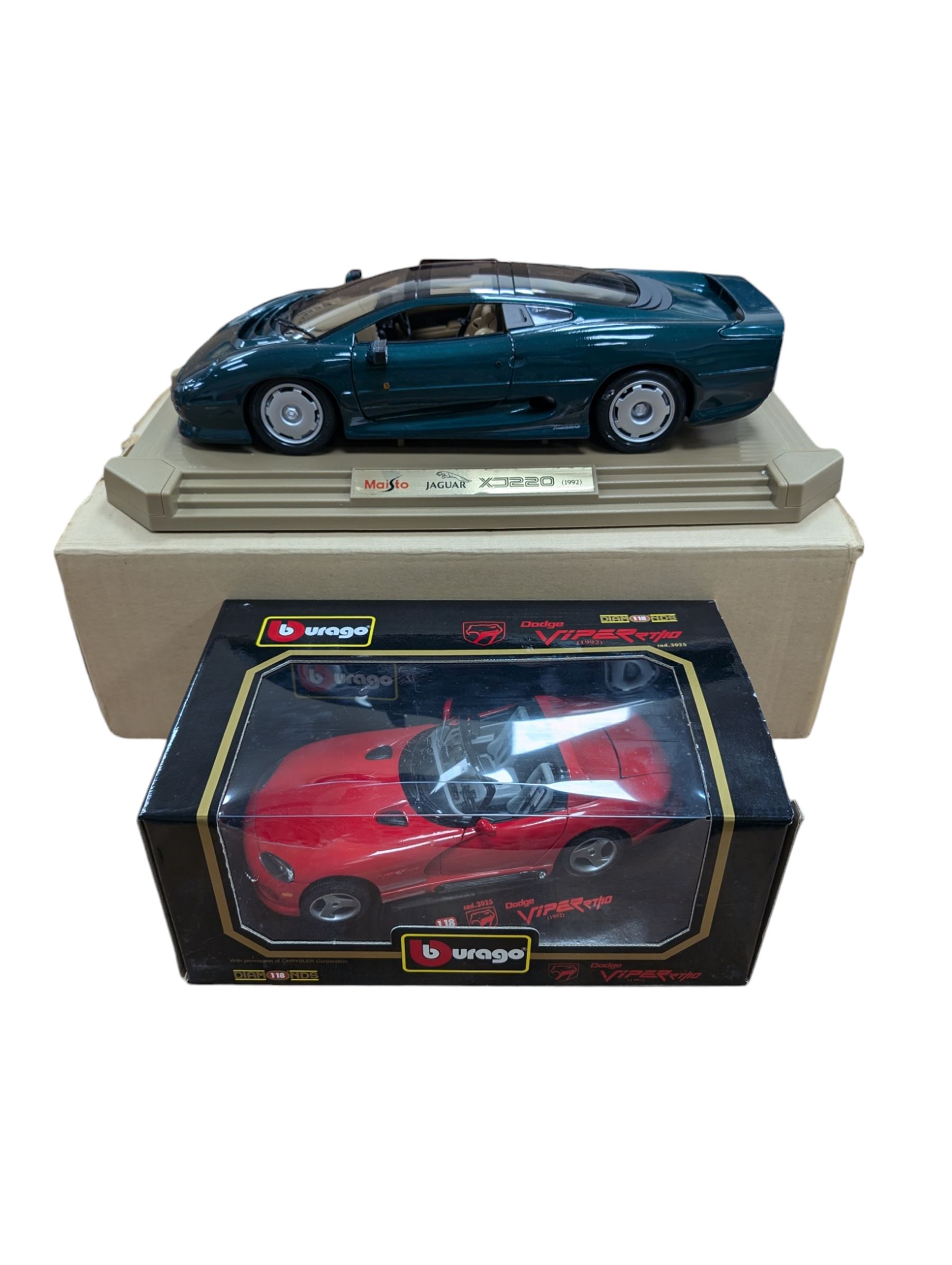 Two diecast cars, comprising Maisto 1:12 scale 1992 Jaguar XJ220 and a Burago 1:18 scale 1992 Dodge Viper RT10, both boxed