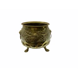 20th Century brass planter with lion mask handles, embossed thistle decoration and three claw feet, H33cm, D32cm.   