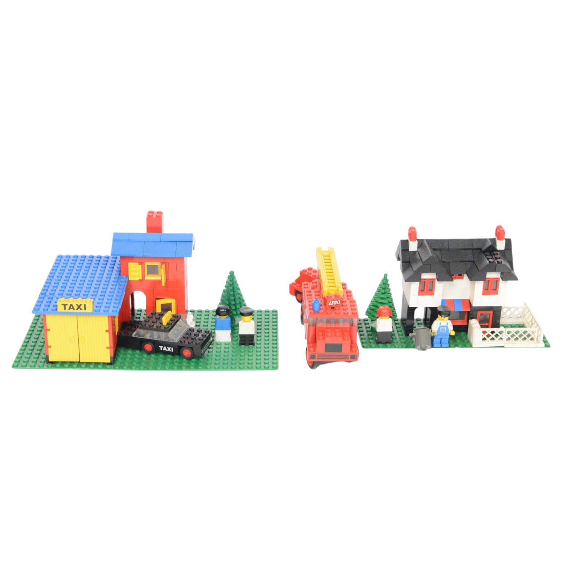 Nine vintage Lego Classic Town vehicles and buildings,  comprising no. 368-1 Taxi  Station, no. 675-1 Snack Bar, no. 374-2 Fire Engine, no. 643-2 Mobile Crane, no. 361-2 Garage, no. 00-2 Weetabix Promotional House, no. 6693 Recycle Truck, no. 6450-1 Mobile Police Truck and no. 6358 Snorkel Squad, all built with minifigures