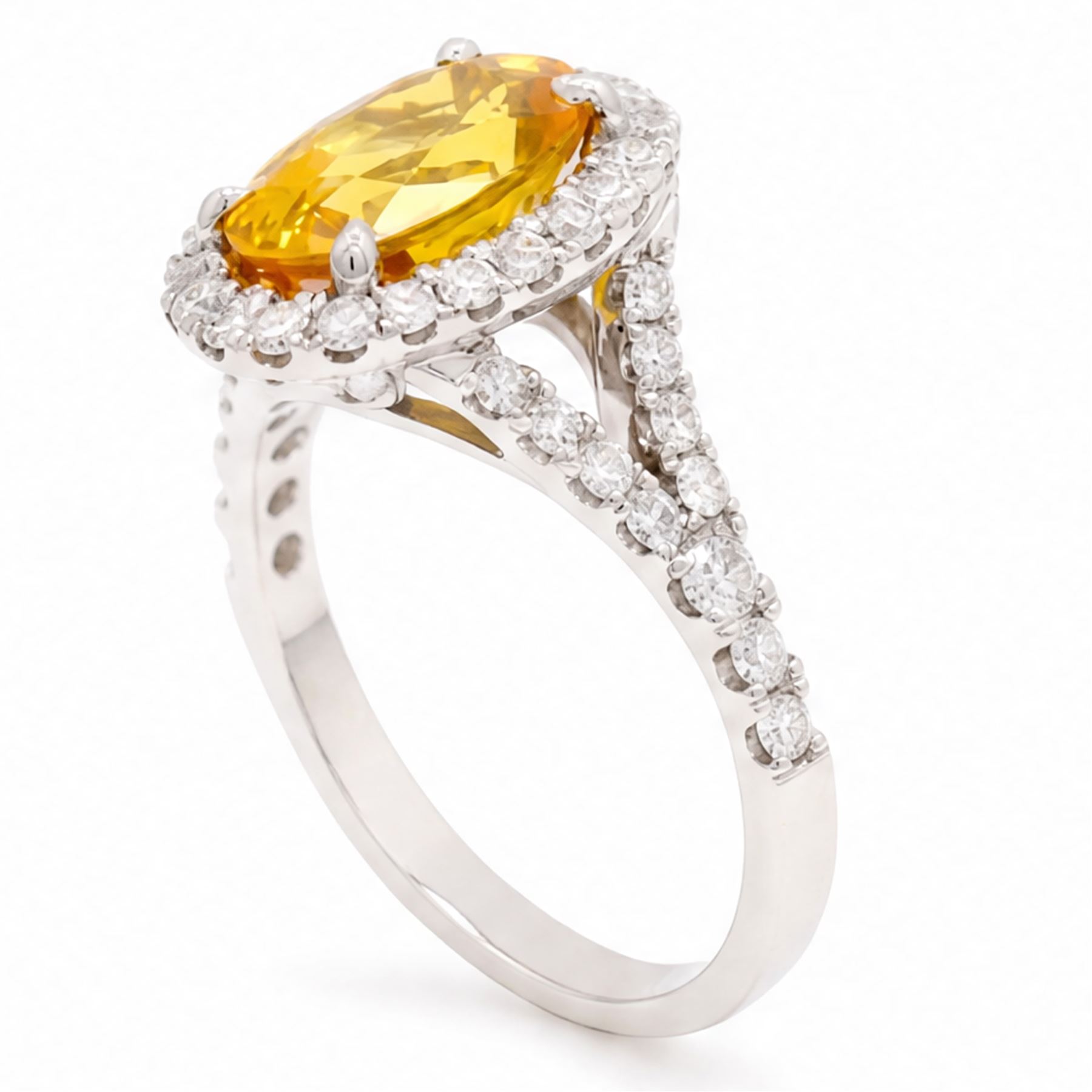 18ct white gold yellow sapphire and diamond ring, single oval cut sapphire of approx 4.20 carat, surrounded by round brilliant cut diamonds and split diamond set shoulders, hallmarked, with World Gemological Institute report