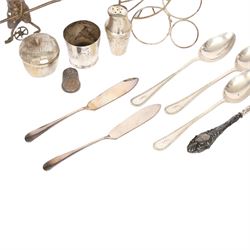 Silver cutlery comprising three teaspoons and two butter knives, a silver handled hook and a silver plated Chinese rickshaw cruet