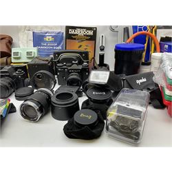 Vintage and later cameras, lenses, accessories and darkroom equipment including Zenit 12XP camera, Praktica BX20 camera fitted with 'Sigma Zoom Master 1:3.5-4.5 f=35-70mm' lens, Praktica LLC camera fitted with 'Carl Zeiss Jena Pancolar 1.8/50' lens, Canon Zoom Lens 'EF 100-300mm 1:5.6', various Jessop and other makers darkroom items including safelight (Red), universal duo tank, multi-mask enlarging easel etc, in three boxes