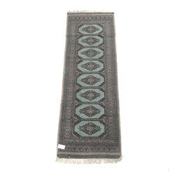 Bokhara green ground runner (185cm x 65cm) and two small rugs (3)