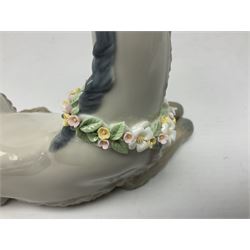 Lladro figures of animals, comprising Mini Lion no 5436, Beautiful Burro no 5683, Hawk Owl no 5422, Beagle Puppy Sitting no 1071, Duck Flying no 1264, Miniature Cat no 5308 and Small Papillon Dog no 4749, four with original boxes, largest example H14cm