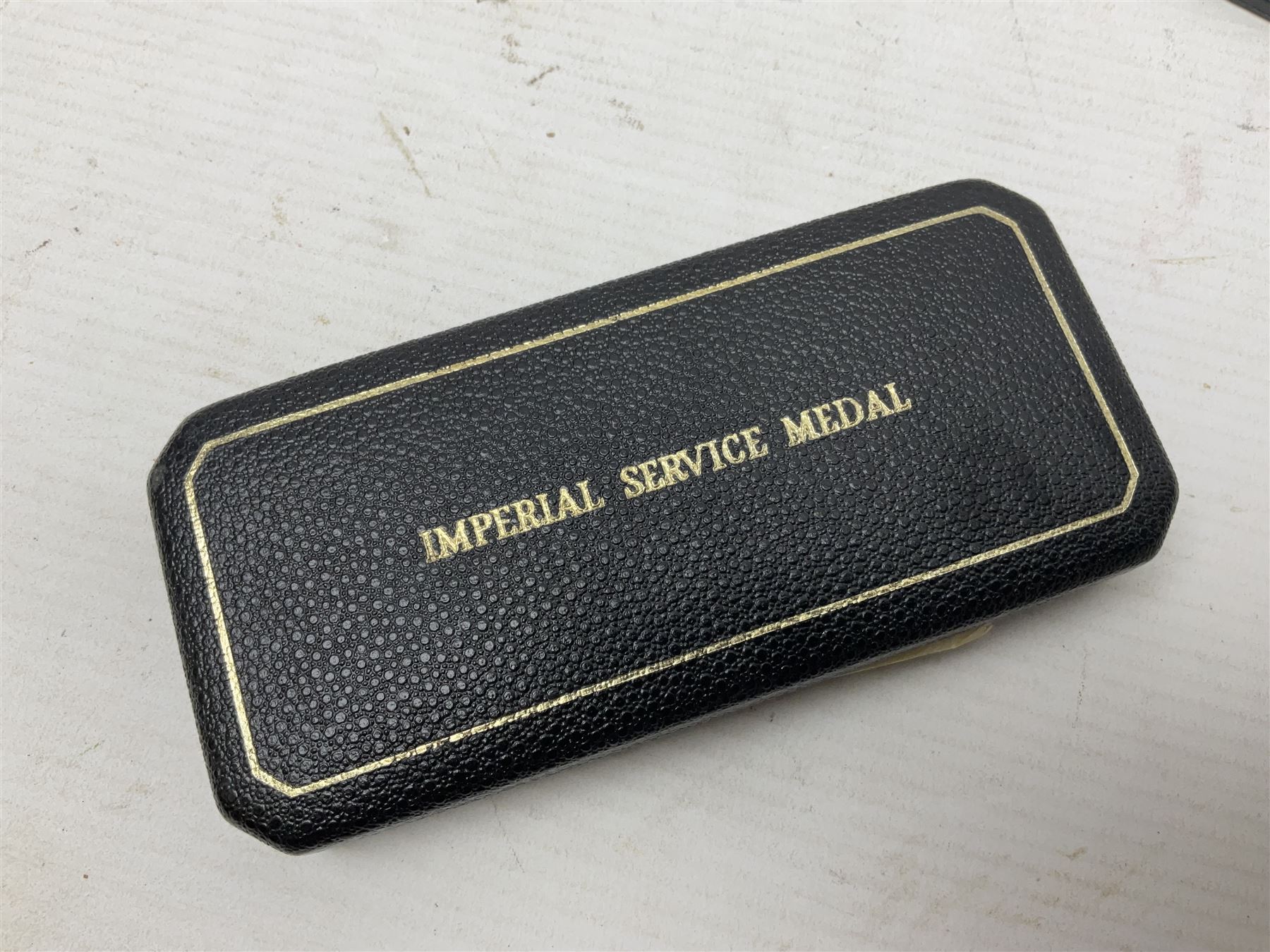 Two Imperial Service Medals to Elsie Hannah Ferguson and Fred Whitehead; each in original case; WWI Special Constabulary Medal to Inspr. Alfred W. Thompson; modern Prisoner of War Medal; cased; replica Victoria Cross and India Mutiny Medals with archive of information relating to Pte. Robert Newell V.C. 9th Lancers; replica Victoria Cross and George Cross with miniatures; and other replica medals etc