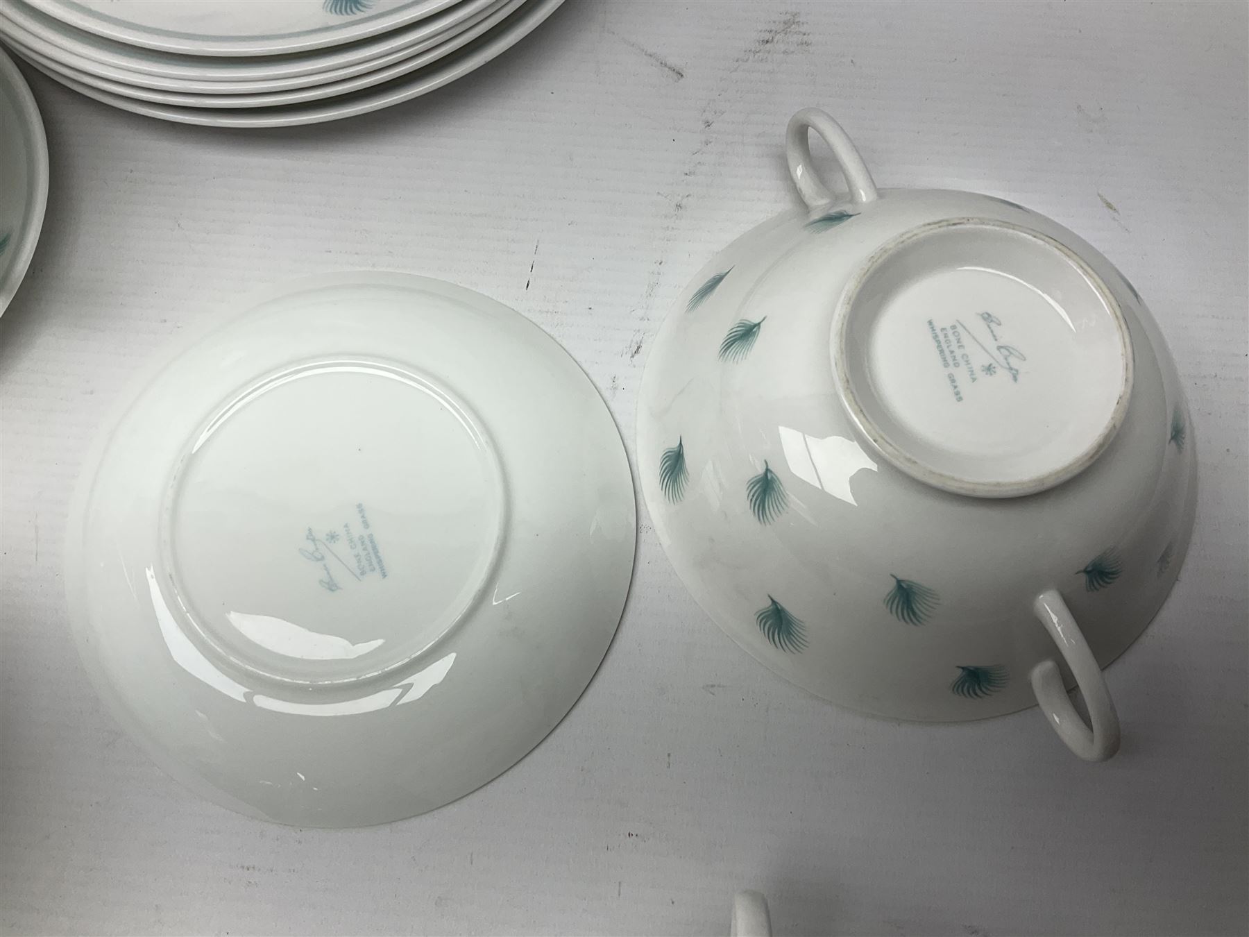 Susie Cooper Whispering Grass pattern dinner wares, to include tureen with cover, six twin handled soup bowls, dinner plates and side plates, etc 