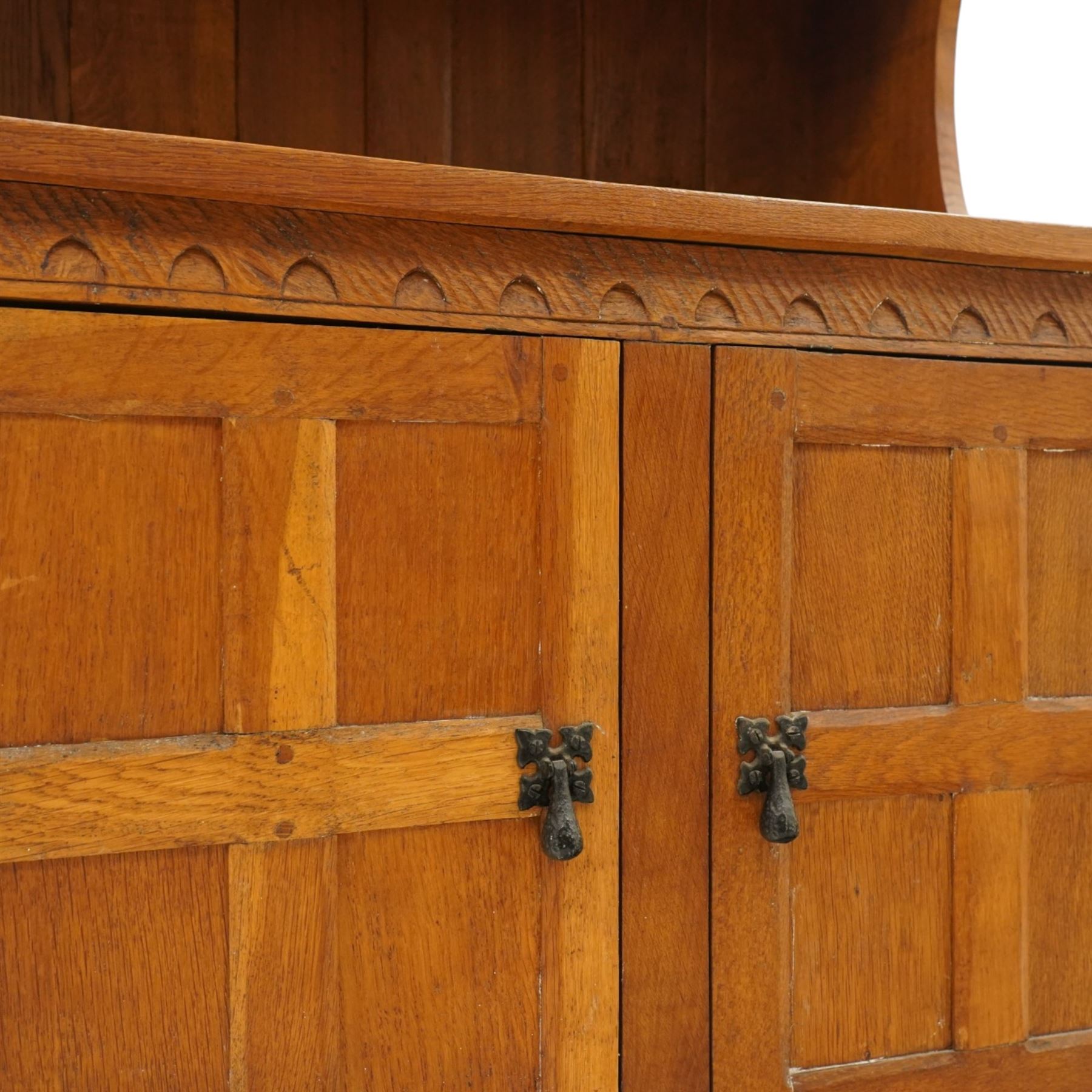 Gnomeman - adzed oak dresser, arcade carved cresting rail over two lead glazed doors, double cupboard below enclosed by two panelled doors, with carved gnome signature, by Thomas Whittaker of Littlebeck 