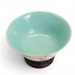 Chinese porcelain famille rose bowl, depicting female figures in a boat, one female seated offering a Lingzhi and a seated female holding out a Ruyi sceptre, against a Anhua ground, the interior with turquoise glaze, red Jiaqing (1796-1820) seal mark beneath, on hardwood stand, D17cm 