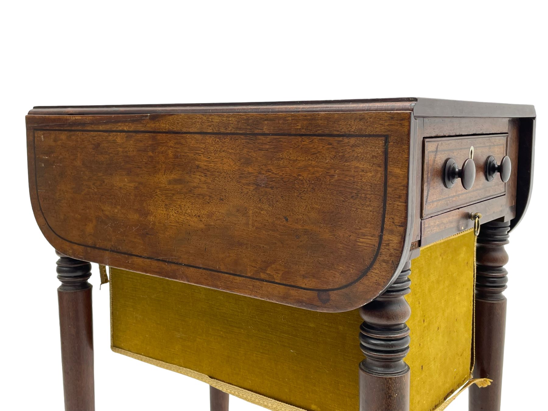 Narrow George III mahogany sewing or work Pembroke table, drop-leaf rectangular top with rounded corners inlaid with ebony stringing, fitted with single full-length cock-beaded drawer and opposing false drawer fascia, turned handles and ivory escutcheons, sliding upholstered storage bag beneath, on ring turned supports with brass cups and castors

This item has been registered for sale under Section 10 of the APHA Ivory Act