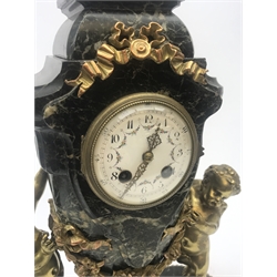 Late 20th century green marble mantel clock, urn shaped with circular Arabic dial, two gilt winged putti either side, floral and ribbon garland mounts, on plinth, twin train movement striking the hours and half on bell, H35cm (with pendulum)