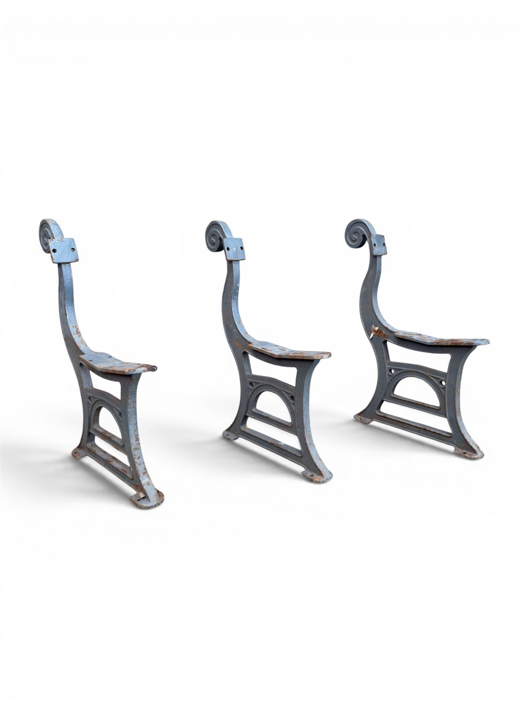 Set of three mid-20th century cast iron towns and park bench ends, scrolling pediment over arched stretchers, length to be altered as desired