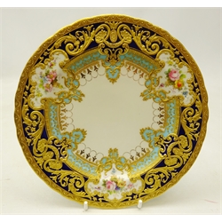  Royal Crown Derby side plate from the Judge Elbert Henry Gary service, circa 1909, hand painted by Albert Gregory, signed, with baskets of flowers in cartouche shaped panels on cobalt blue and turquoise ground with raised gilded border incorporating an oval medallion with the initial 'G' by George Darlington, signed, printed backstamp in gilt with Royal Warrant and Tiffany & Co retailer's mark, D18cm.  Provenance Property of Bob Heath, Brandesburton Formerly of Ravenfield Hall Farm near Rotherham  