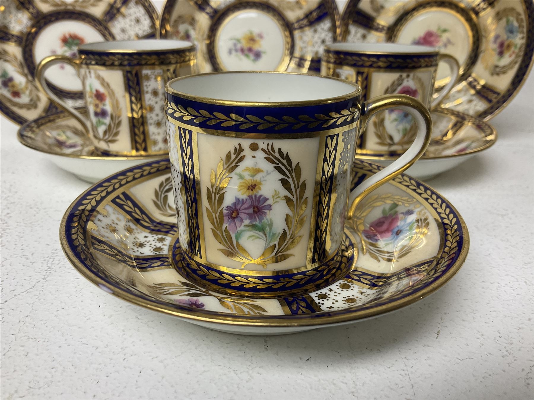 Paragon thee coffee cans and saucers, painted in gilt and colours with flowers, Paragon set of six coffee cups and saucers, 'Reproduction of Service accepted by Her Majesty Queen on her visit to the potteries, with three matching saucers