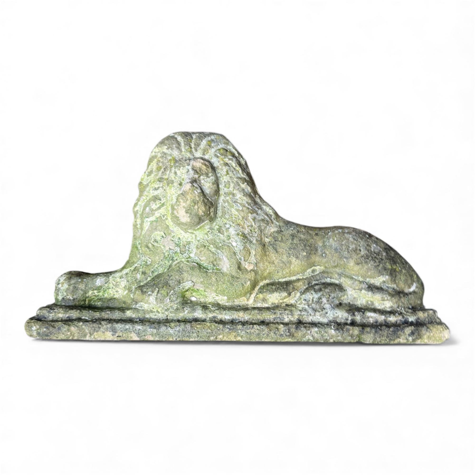 Two large cast stone figures with small lion and face stone pieces