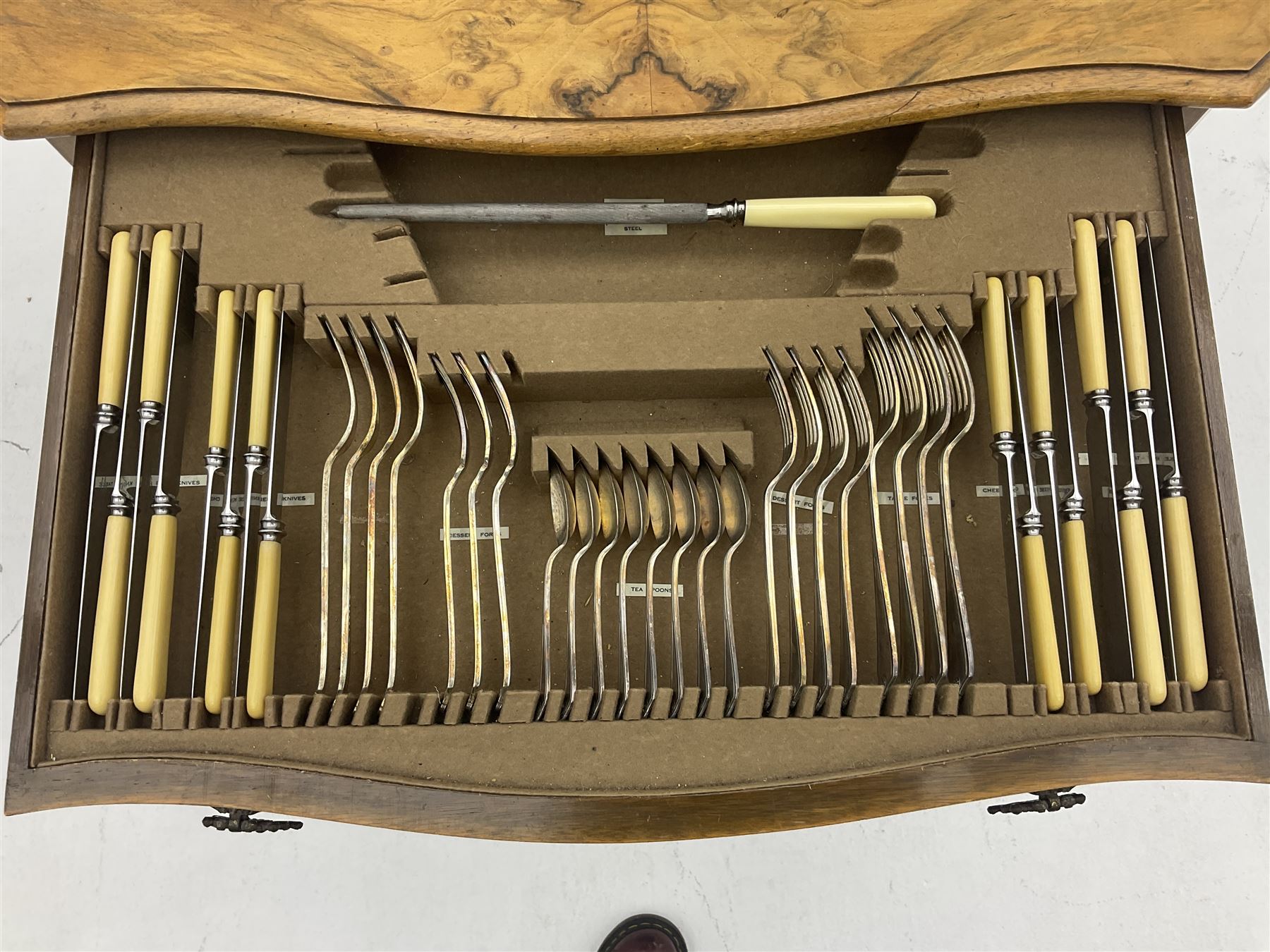 Canteen of Robert F. Mosley Rusnorstain silver-plate cutlery, eight settings- complete, in walnut two drawer canteen table on cabriole legs 